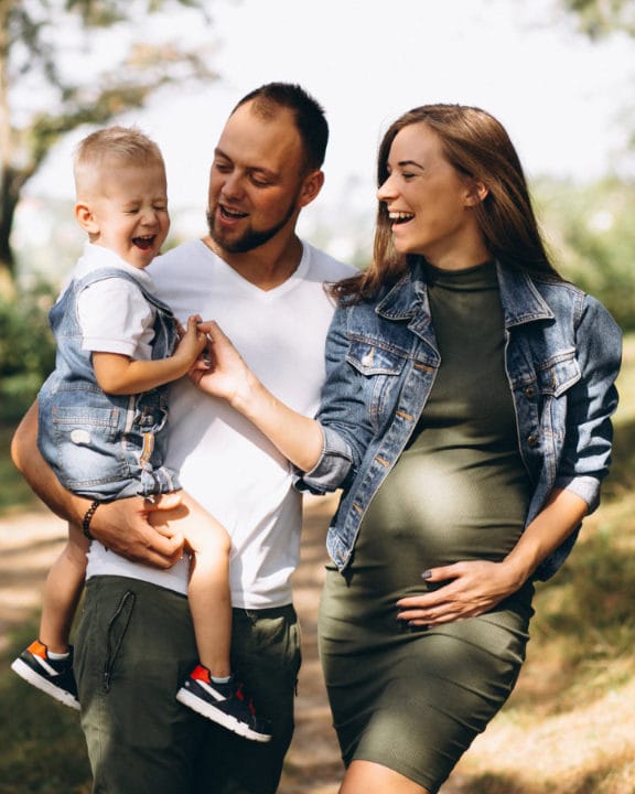Family smiling together outdoors