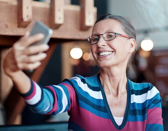 Patient enjoying restored smile and chewing function